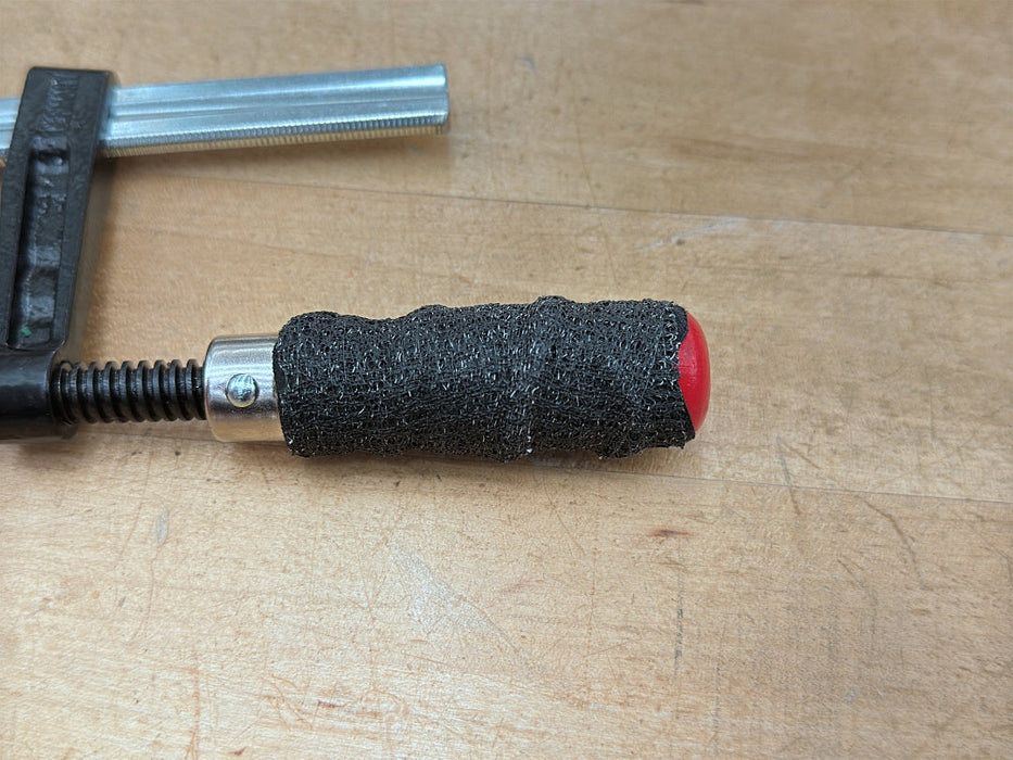 Wooden clamp handle wrapped with grip tape