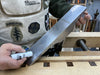 Person applying wax to the sole of a metal hand plane